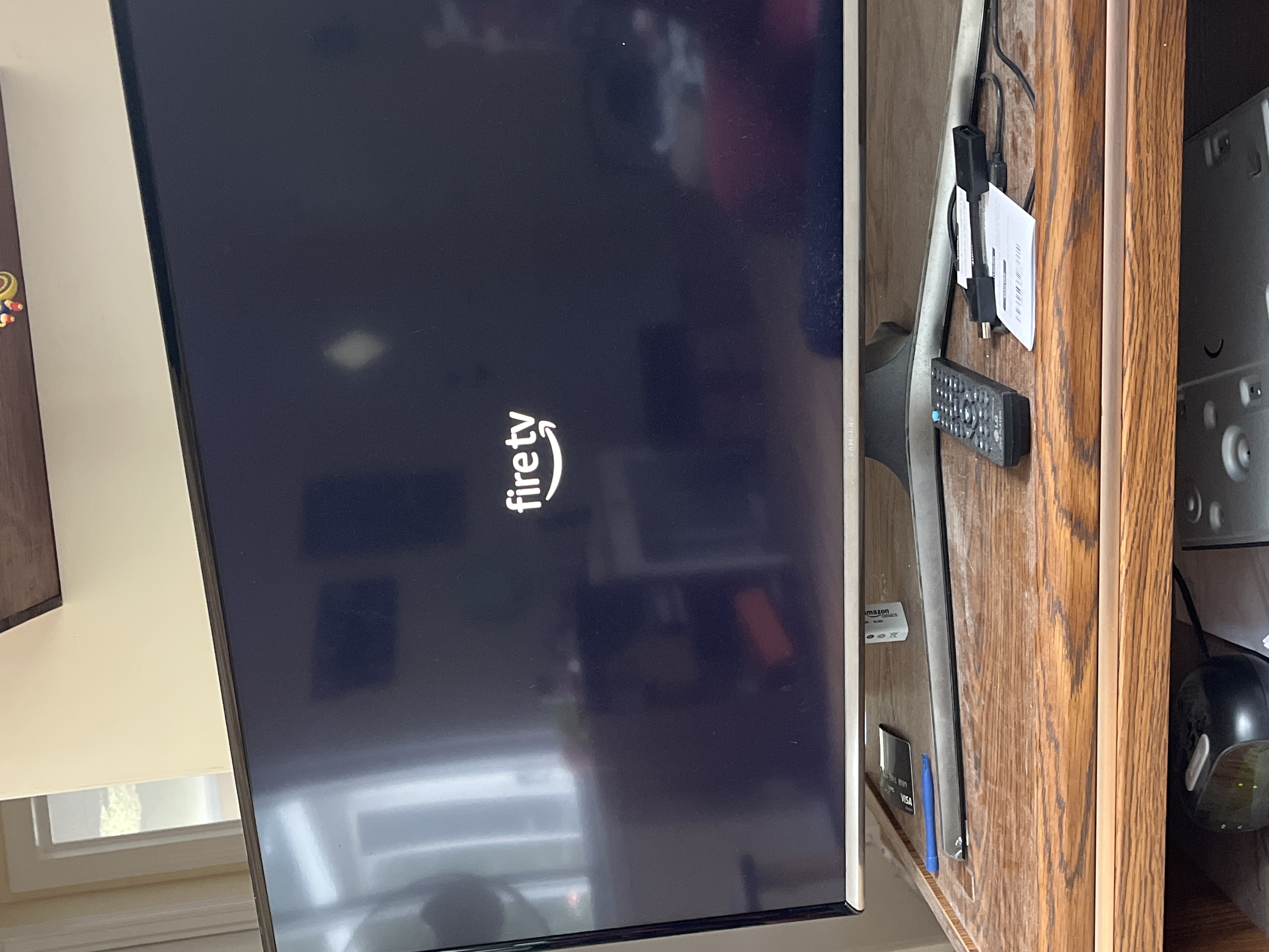 Why is my tv stuck on a black screen with Fire TV logo?